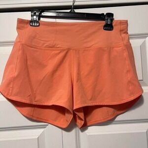Lululemon Speed Up High-Rise lined shorts in the color Sunny Coral